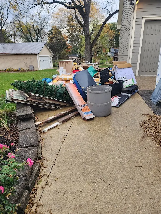 Dumpster being loaded with debris for Demolition Dumpster Rental in Easttown